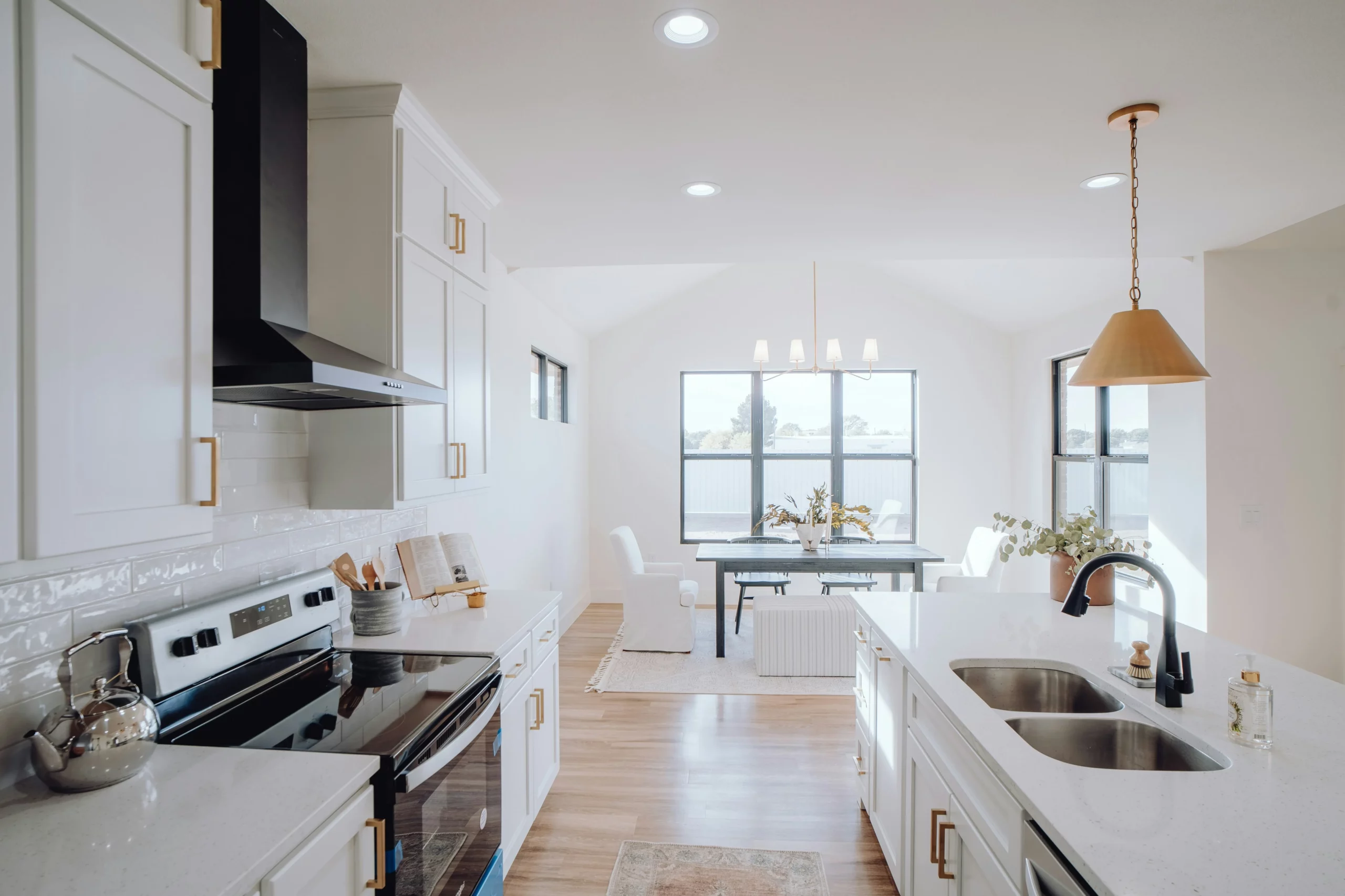 image of clean white kitchen with gold cabinet hardware in an Arizona home