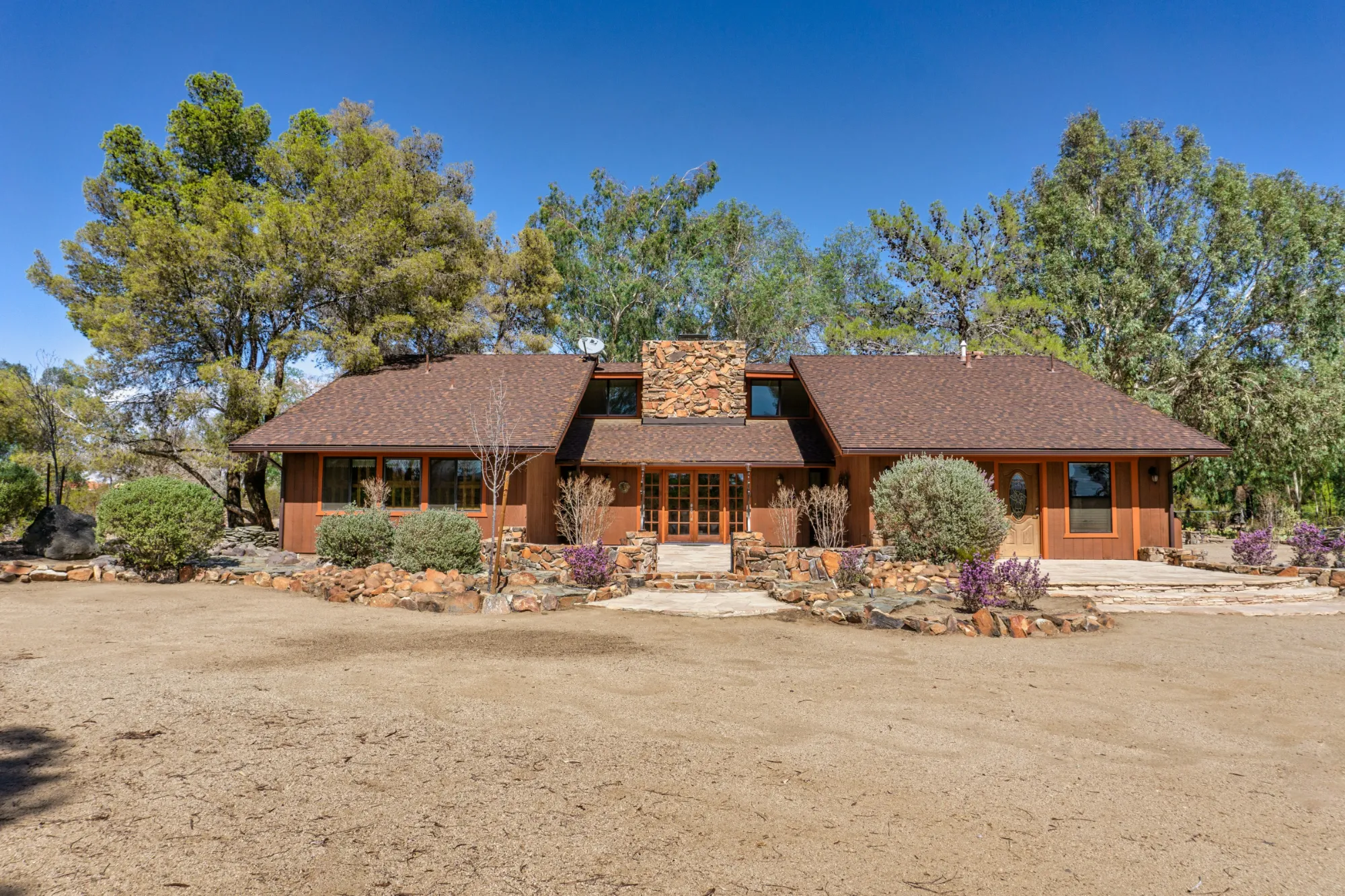 Ranch-style home with desert landscaping