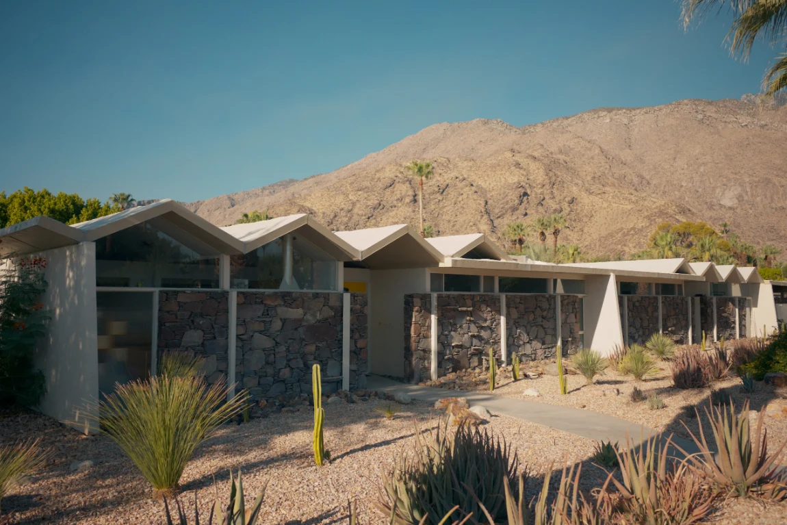 Mid-century desert home with mountains behind it