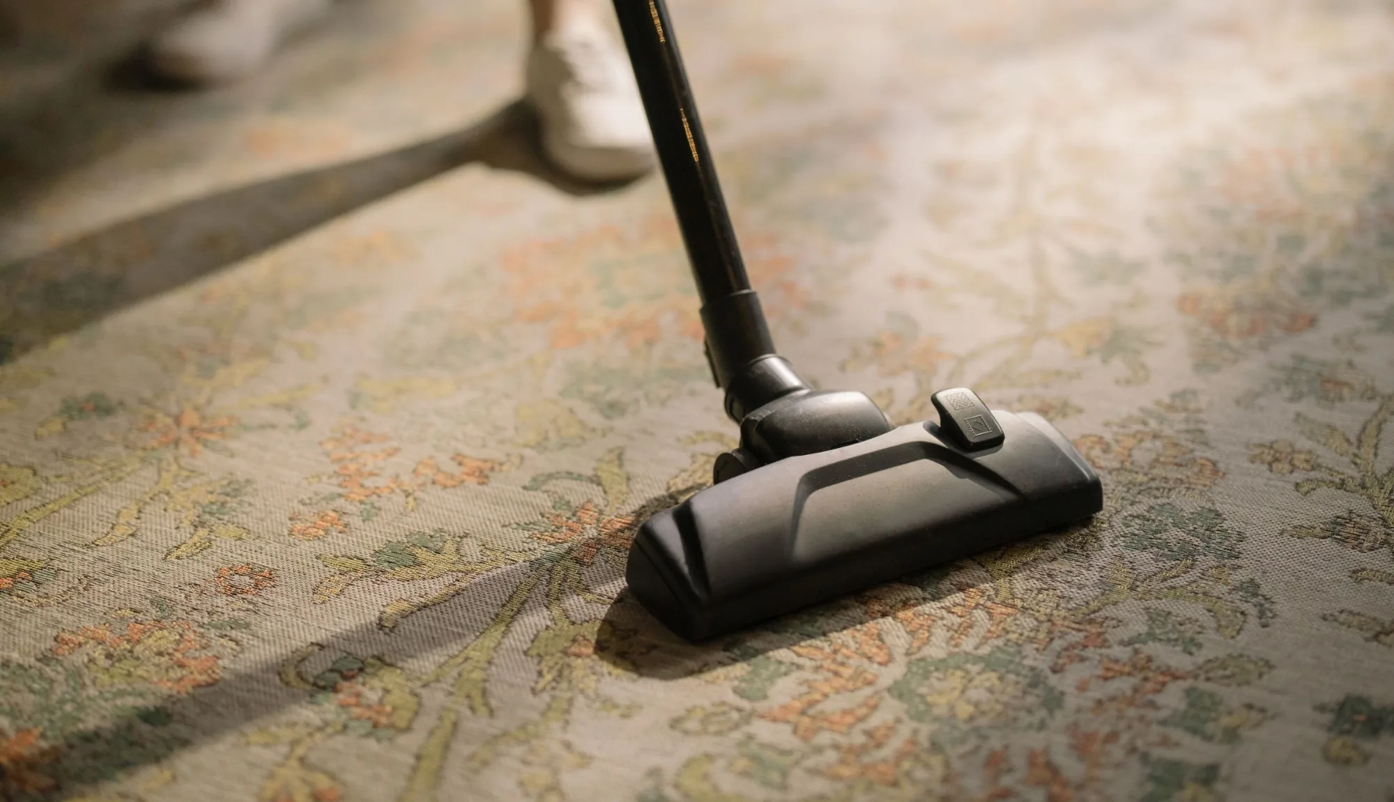 Vacuuming an area rug