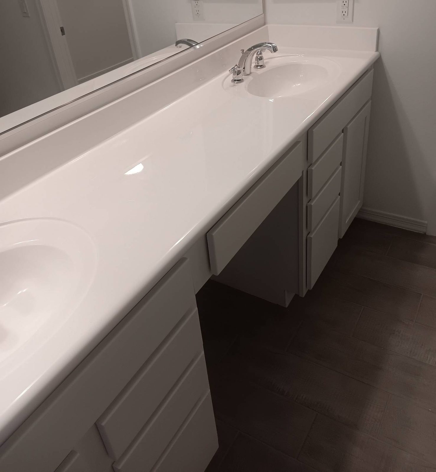 Clean white double vanity with two sinks after a house cleaning in Buckeye, AZ