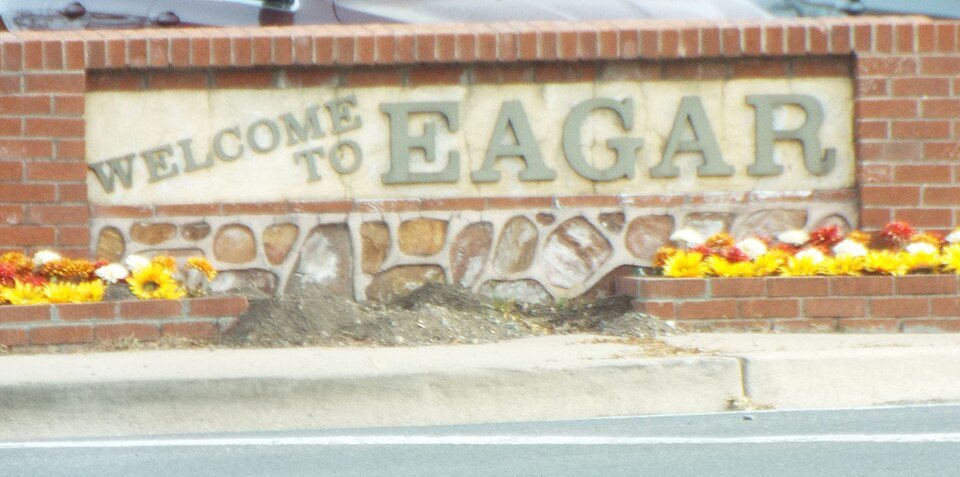 Brick Welcome to Eagar sign with flowers in Eagar, Arizona