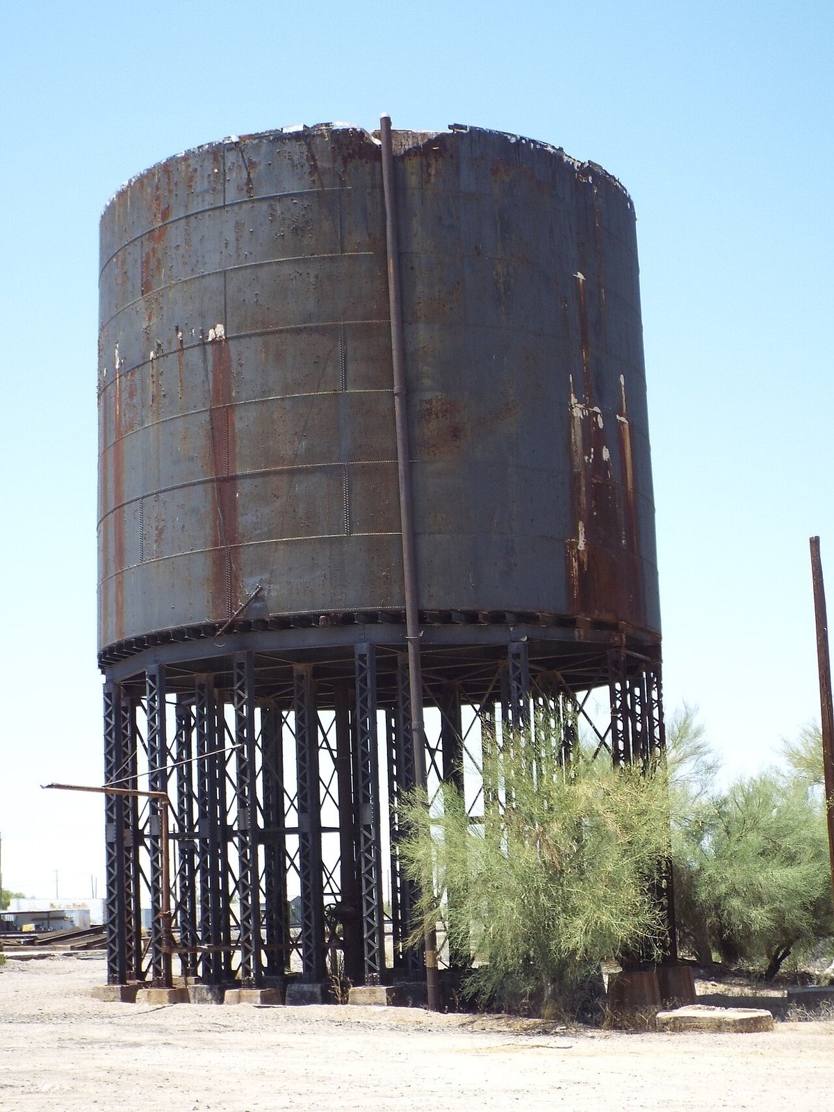 Old steel water tower on stilts at a historic water stop in Gila Bend, Arizona