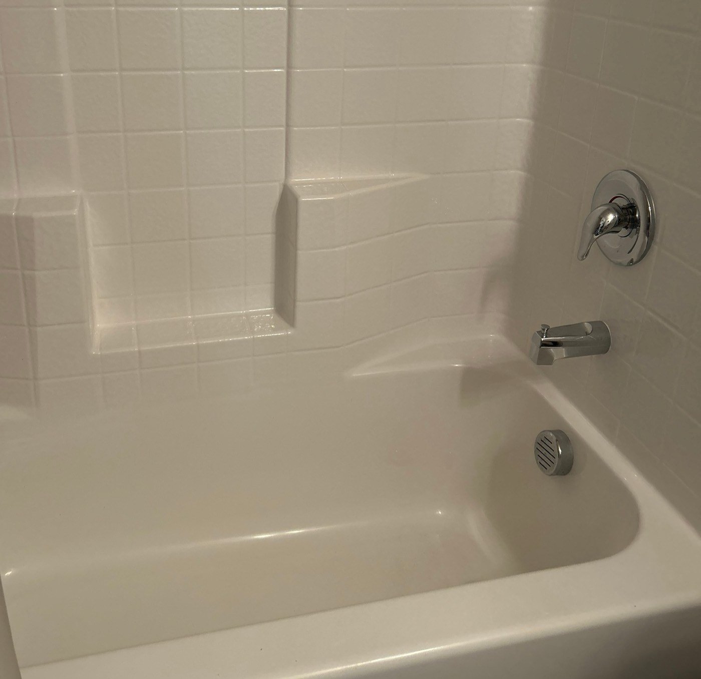 Bathtub and tile shower wall clean after a cleaning in Coolidge, AZ