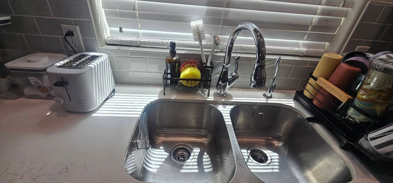 Double kitchen sink empty and clean after a cleaning in Yuma, AZ