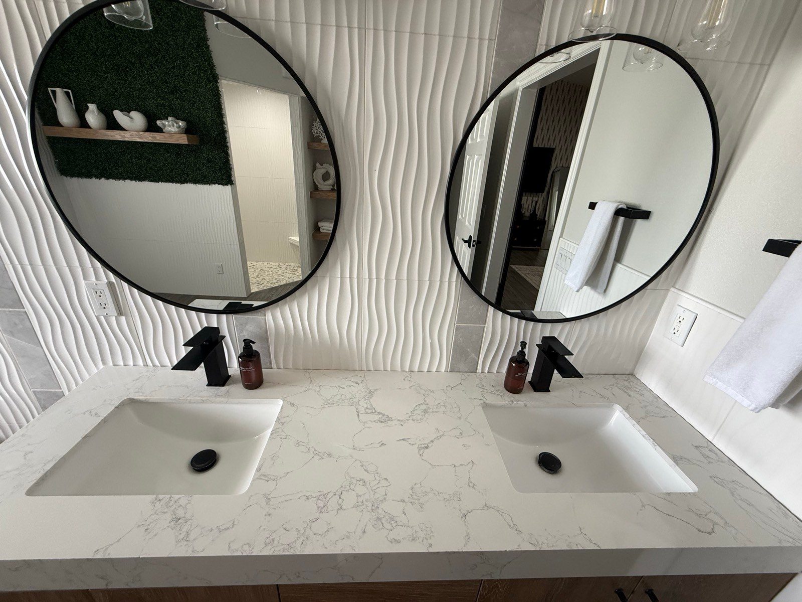 Clean double sink vanity with round mirrors after a cleaning in Lake Havasu City, AZ