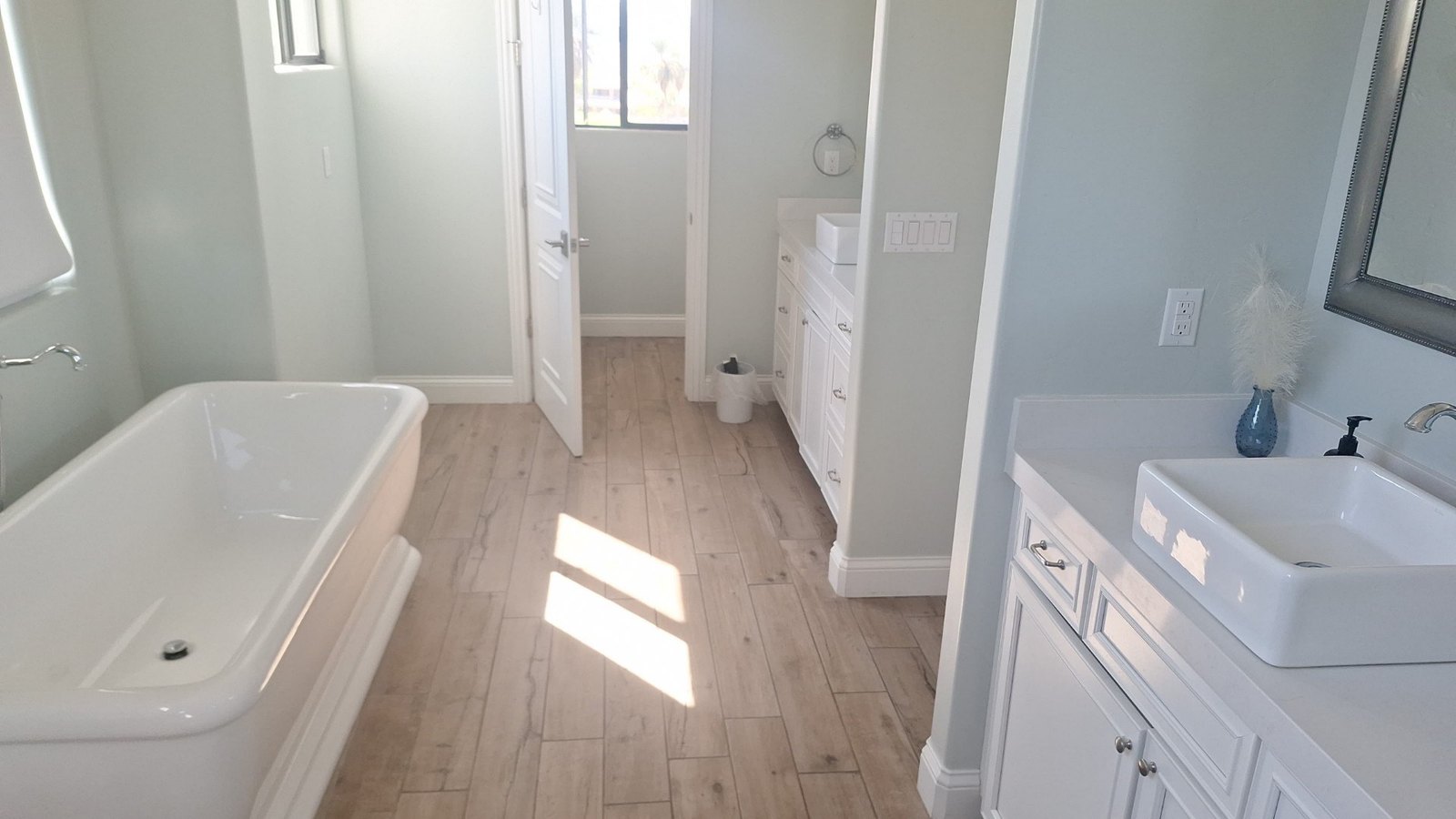 Bright bathroom with a clean freestanding tub and vessel sink after an Airbnb cleaning in Lake Havasu City, AZ