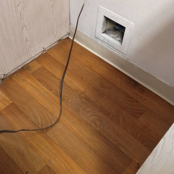 Same laundry closet floor wiped clean after a move-out cleaning in Mesa, AZ