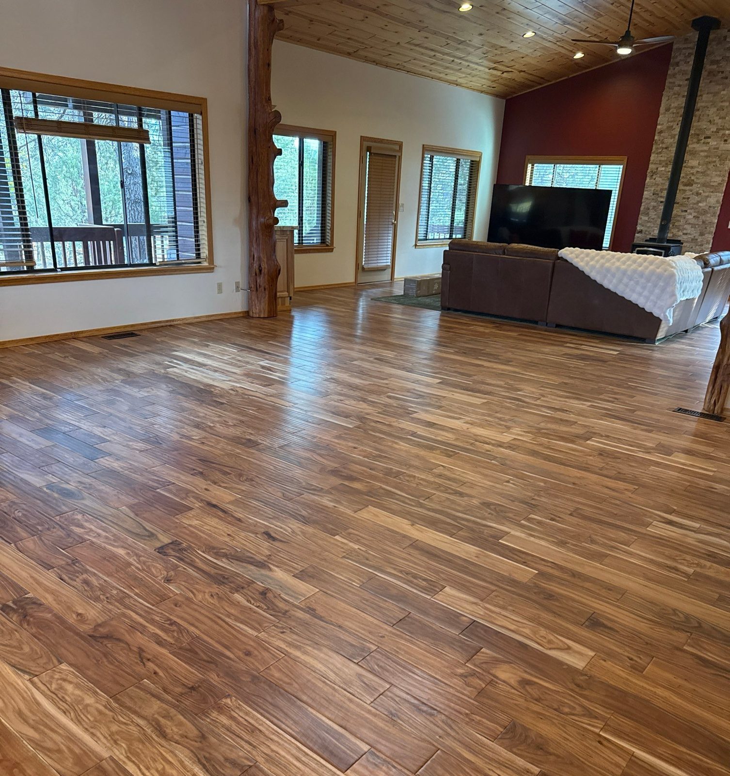 Open living room with clean, shiny hardwood floors after a cleaning in Overgaard, AZ