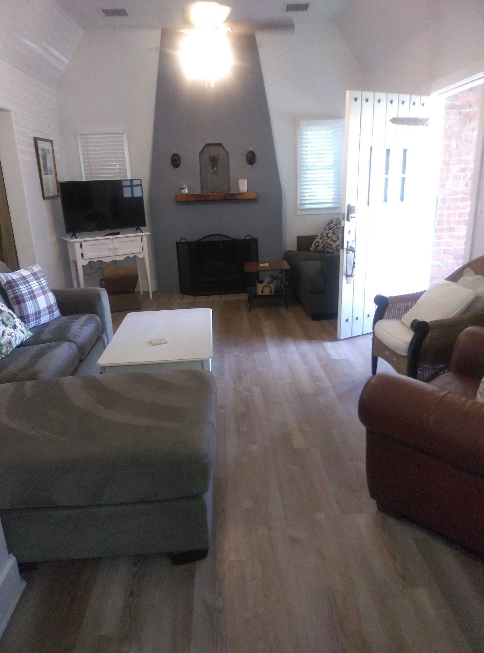 Clean living room with sectional sofa and fireplace in Prescott, AZ