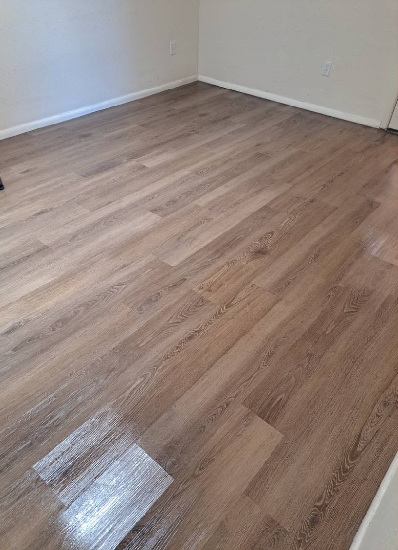 Empty bedroom with freshly mopped wood-look floors after a move-out cleaning in Sedona, AZ