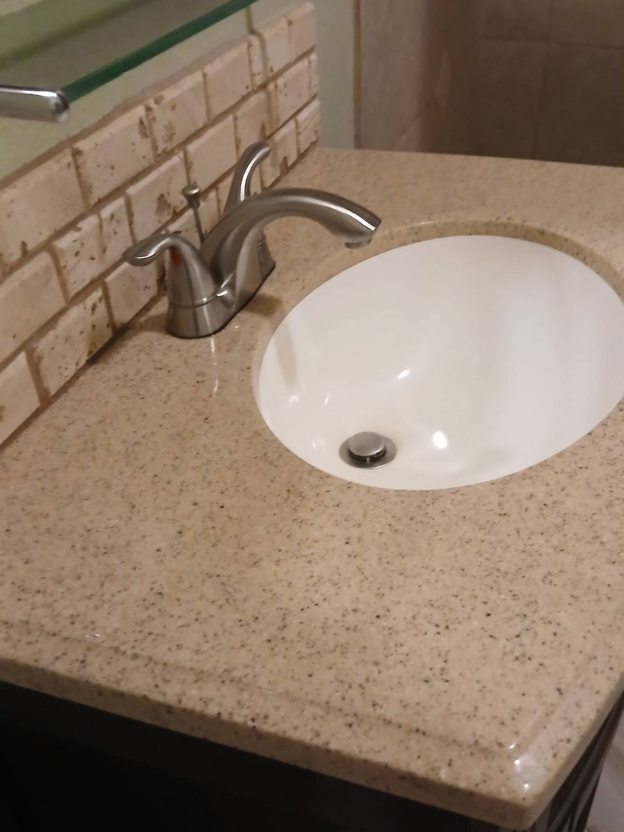 Clean bathroom vanity sink and counter after a house cleaning in Show Low, AZ