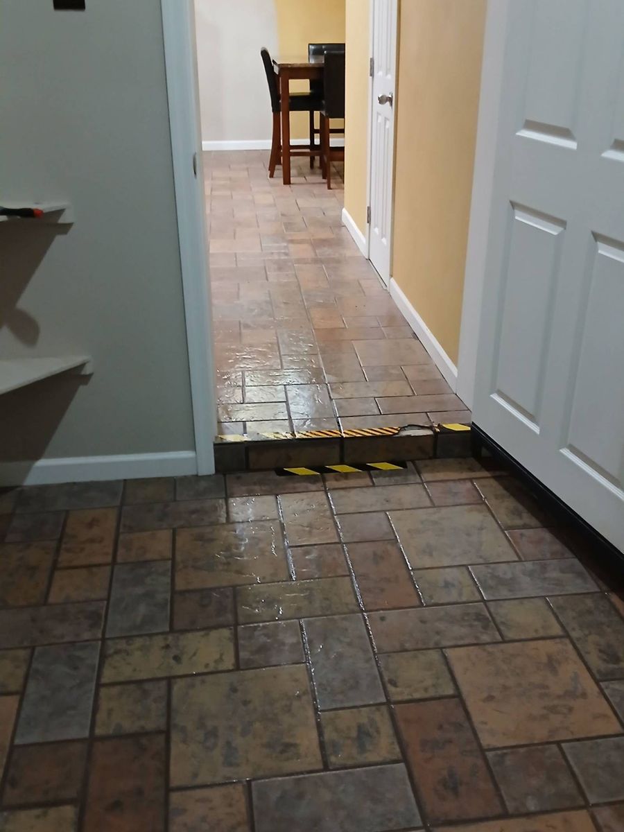 Freshly mopped tile floor in a hallway after a house cleaning in Show Low, AZ