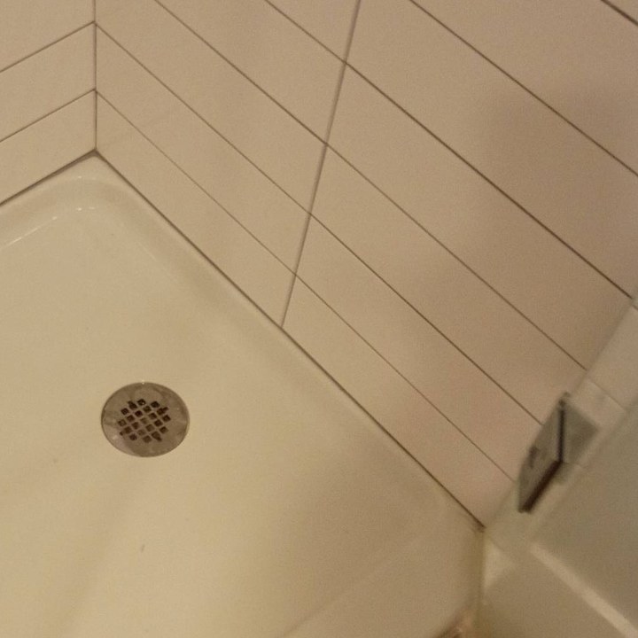 Same shower pan clean and white after a cleaning in Goodyear, AZ