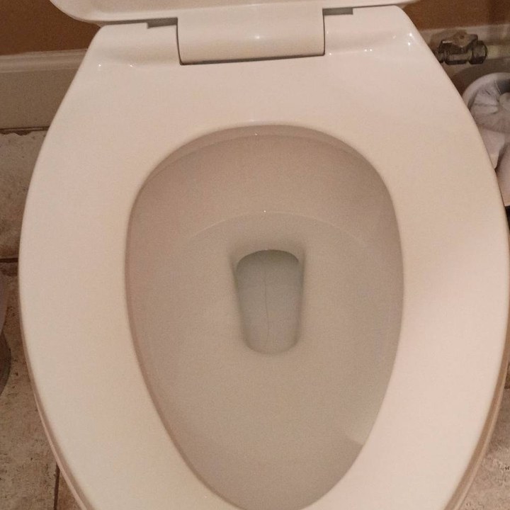 Same toilet with a clean white bowl after cleaning in Black Canyon City, AZ