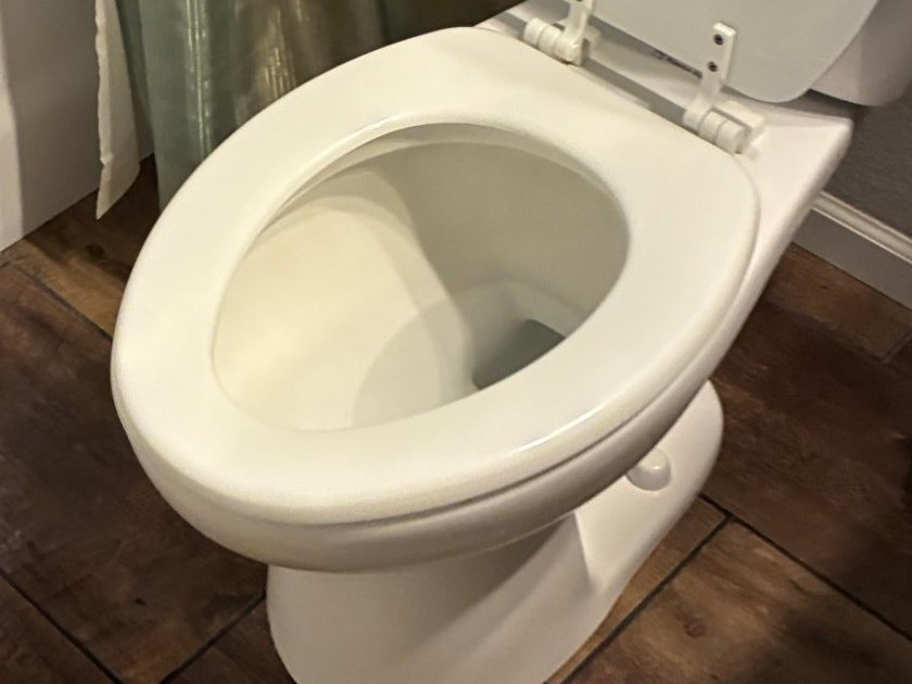 Same toilet with a clean white bowl after a cleaning in Paulden, AZ