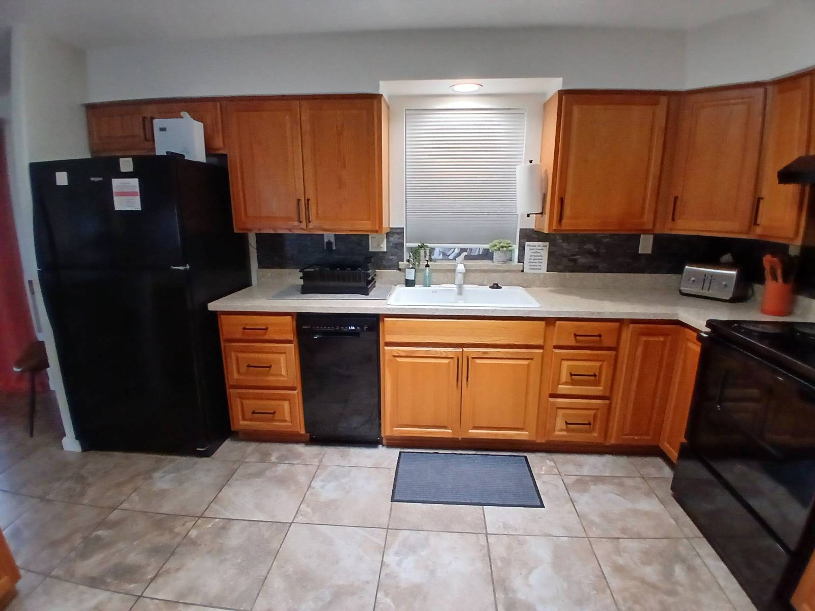 Clean kitchen counters, sink and tile floor after a vacation rental cleaning in Williams, AZ