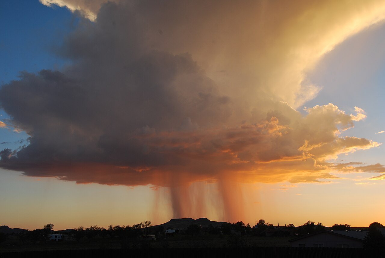 Monsoon storm with rain shafts at sunset near Williamson Valley, Arizona